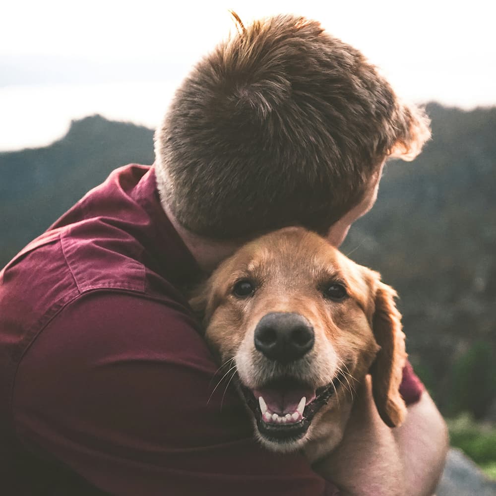 eric-ward-ISg37AI2A-s-unsplash Man and dog